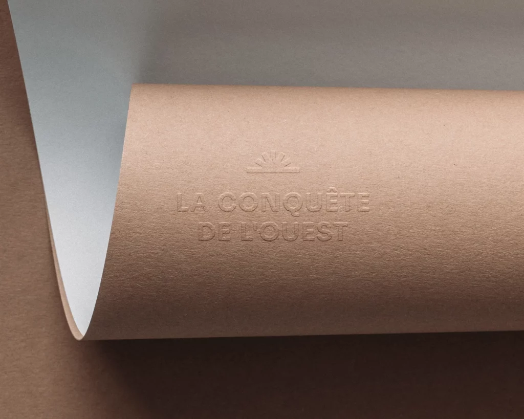 logotype la conquête de l'ouest société spectacle région studio aïe